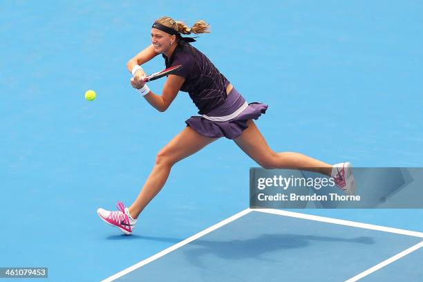 Petra Kvitova of the Czech Republic plays a backhand in her second round match against Christina McHale of the USA during day three of the 2014...