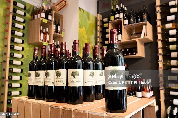 Parisian wine merchants in Paris on October 19, 2014. A Bottle of Organic wine Le Petit Champ 2010 appelation Sainte-Foy Bordeaux from the cellar of...