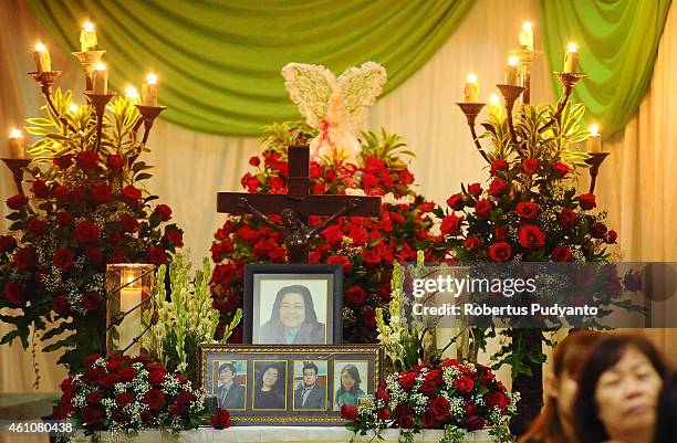 The coffin of Shiane Josal, a victim of the AirAsia flight QZ8501 disaster is laid out at Adi Yasa funeral house on January 6, 2015 in Surabaya,...
