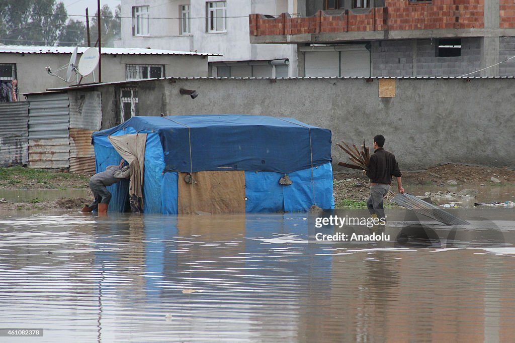 Tents set up by Syrians flooded in Turkey's Adana