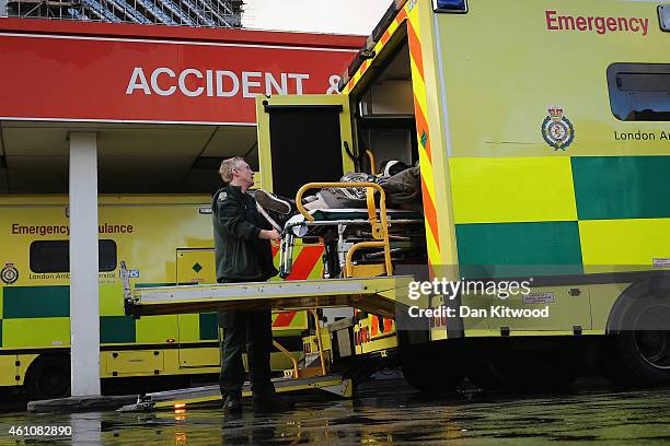 Patient is taken from an ambulance outside the Accident and Emergency ward at St Thomas' Hospital on January 6, 2015 in London, United Kingdom....