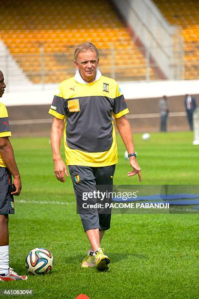 Cameroon national football team coach German football manager Volker Finke looks on as team members train at the Yaounde Ahmadou Ahidjo Stadium, on...