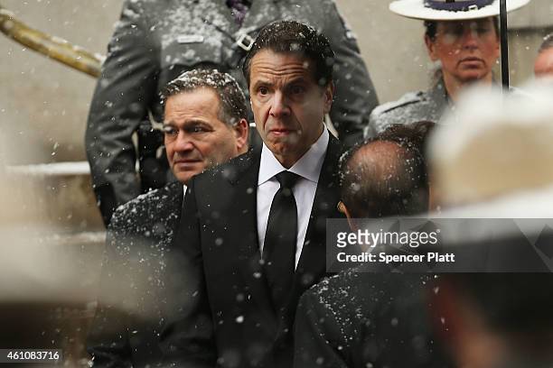 New York Gov. Andrew Cuomo watches as the hearse carrying the casket of his father, former three-term governor Mario Cuomo, arrives at St. Ignatius...