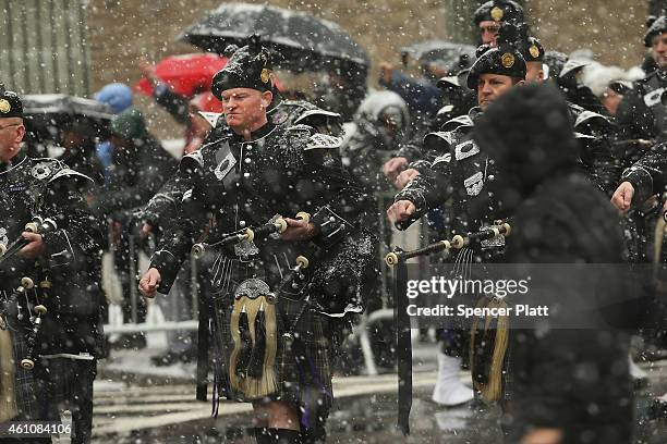 Bagpipers lead the procession of the hearse carrying the casket of former three-term governor Mario Cuomo into St. Ignatius Loyola Church on January...