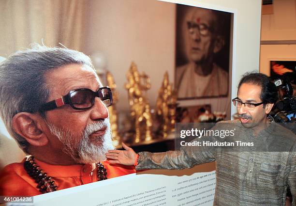 Shiv Sena President Uddhav Thackeray showing portrait of his father late Bala Saheb Thackeray during the inauguration his infrared photography...