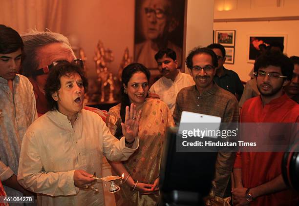 Shiv Sena President Uddhav Thackeray with his family and Zakir Hussain during the inauguration his infrared photography exhibition at Jehangir Art...