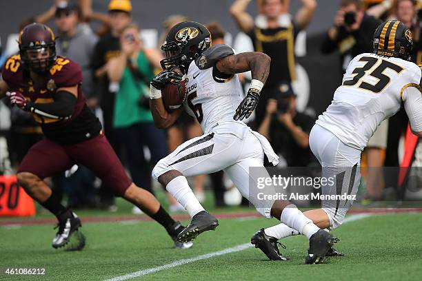 Marcus Murphy of the Missouri Tigers runs the football during the Buffalo Wild Wings Citrus Bowl against the Minnesota Golden at the Florida Citrus...