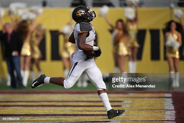 Marcus Murphy of the Missouri Tigers runs the football for a touchdown that was nullified by a penalty during the Buffalo Wild Wings Citrus Bowl...