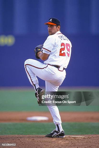 John Smoltz of the Atlanta Braves pitches during an Major League Baseball spring training game circa 1996 at West Palm Beach Municipal Stadium in...