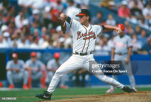 Tom Glavine of the Atlanta Braves pitches against the Philadelphia Phillies during an Major League Baseball game circa 1993 at Atlanta-Fulton County...