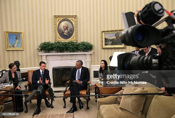 President Barack Obama meets with Mexican President Enrique Pena Nieto in the Oval Office of the White House January 6, 2015 in Washington, DC. The...