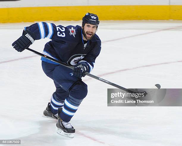 Jay Harrison of the Winnipeg Jets follows the play up the ice during second period action against the Minnesota Wild on December 29, 2014 at the MTS...