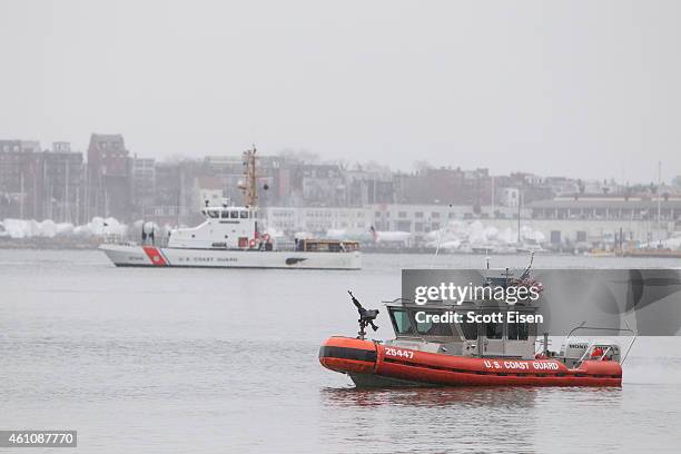 Coast Guard boats patrol Boston Harbor outside of the Moakley Federal Courthouse on the second day of jury selection for the trail of Boston Marathon...
