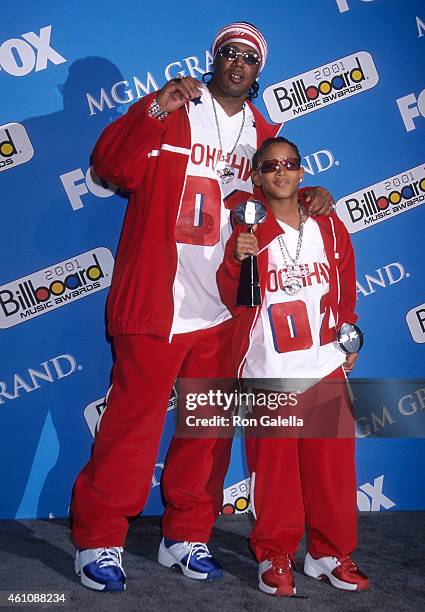 Rapper Master P and son rapper Lil' Romeo attend the 12th Annual Billboard Music Awards on December 4, 2001 at the MGM Grand Garden Arena in Las...