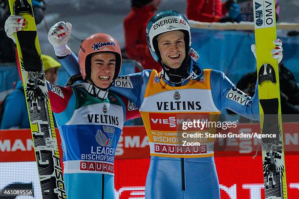 Michael Hayboeck of Austria takes 2nd place, Stefan Kraft of Austria takes 1st place during the FIS Ski Jumping World Cup Vierschanzentournee on...