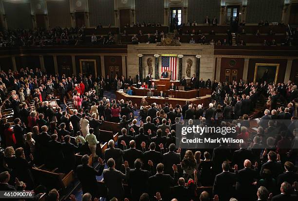 Members of the 114th Congress raise their right hand as they are sworn in at the US Capitol January 6, 2015 in Washington, DC. Today Congress...