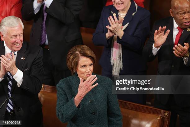House Minority Leader Nancy Pelosi blows kisses to her supporters during the opening session of the 114th Congress in the House of Representatives...