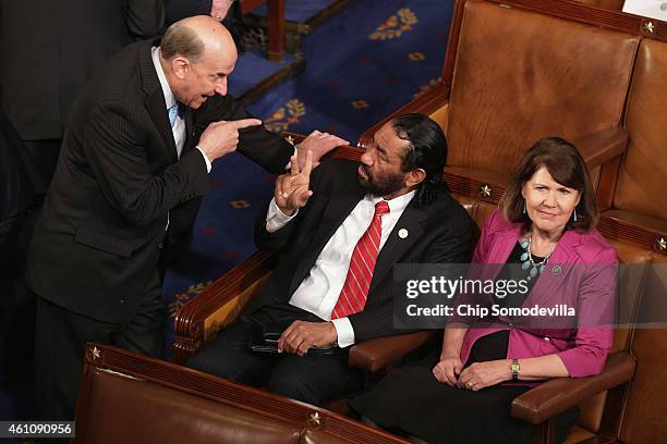 Rep. Louie Gohmert talks with Rep. Al Green before the start of the 114th Congress in the House of Representatives chamber at the U.S. Capitol...