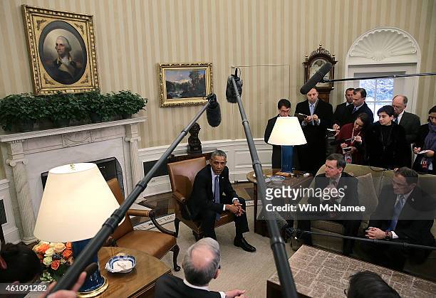 President Barack Obama meets with members of the National Governors Association in the Oval Office of the White House January 6, 2015 in Washington,...