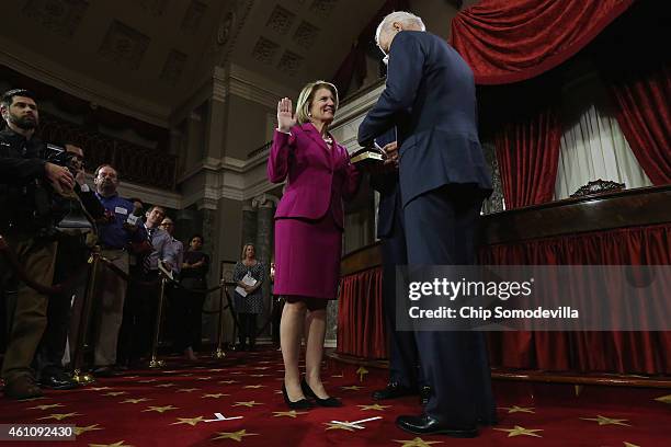 Sen. Shelley Moore Capito is ceremonially sworn in by Vice President Joe Biden in the Old Senate Chamber at the U.S. Capitol January 6, 2015 in...