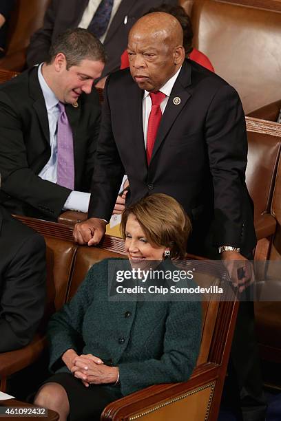 Rep. John Lewis stands to cast his vote for House Minority Leader Nancy Pelosi to be Speaker of the House during the opening session of the 114th...