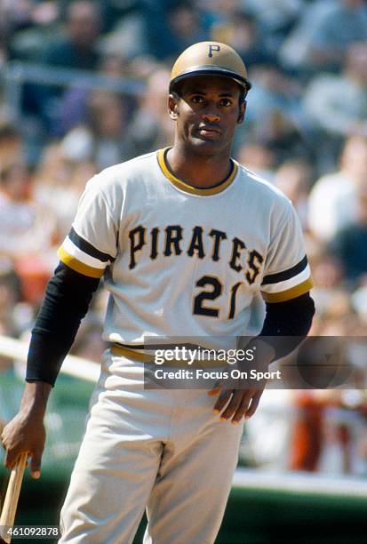 Outfielder Roberto Clemente' #21of Pittsburgh Pirates stands in the batters box and looks on during an Major League Baseball game circa 1970....