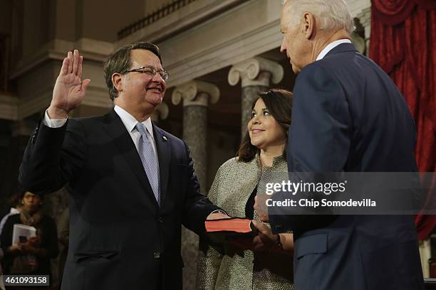 Sen. Gary Peters is ceremonially sworn in by Vice President Joe Biden in the Old Senate Chamber with Peters' wife Colleen Ochoa at the U.S. Capitol...