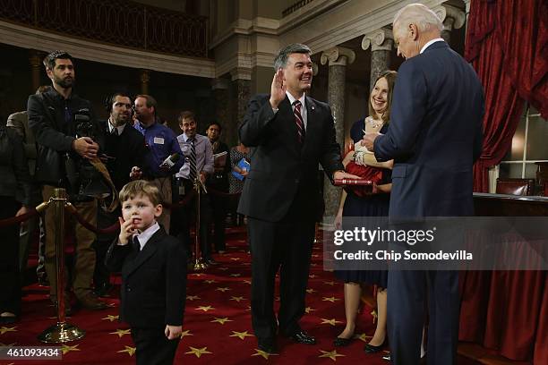 Sen. Cory Gardner is ceremonially sworn in by Vice President Joe Biden in the Old Senate Chamber with Gardner's wife Jaime Gardner and son Thatch at...