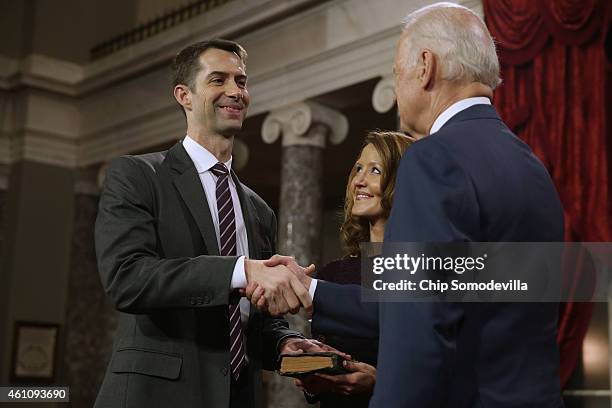 Sen. Tom Cotton is congratulated by Vice President Joe Biden during a ceremonial swearing in at the Old Senate Chamber with Cotton's wife Anna Cotton...