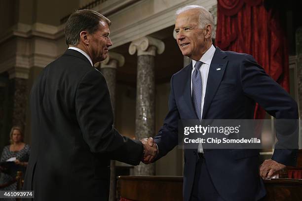 Sen. Mike Rounds greets Vice President Joe Biden during a ceremonial swearing in ceremony in the Old Senate Chamber at the U.S. Capitol January 6,...