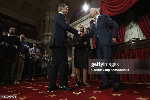 Sen. David Perdue and his wife Bonnie Perdue are congratulated by Vice President Joe Biden during a ceremonial searing in ceremony in the Old Senate...