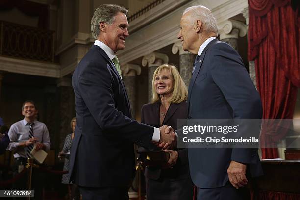 Sen. David Perdue and his wife Bonnie Perdue are congratulated by Vice President Joe Biden during a ceremonial searing in ceremony in the Old Senate...