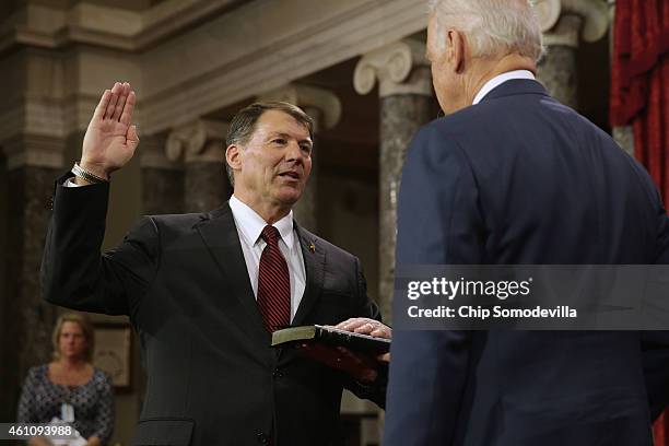 Sen. Mike Rounds is ceremonially sworn in by Vice President Joe Biden in the Old Senate Chamber at the U.S. Capitol January 6, 2015 in Washington,...