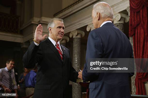 Sen. Thom Tillis is ceremonially sworn in by Vice President Joe Biden in the Old Senate Chamber at the U.S. Capitol January 6, 2015 in Washington,...
