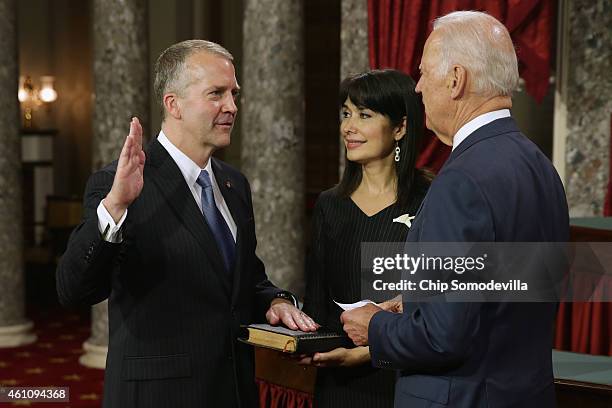 Sen. Dan Sullivan is ceremonially sworn in by U.S. Vice President Joe Biden in the Old Senate Chamber with Sullivan's wife Julie Fate Sullivan at the...