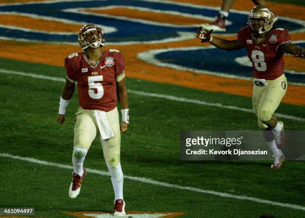 Quarterback Jameis Winston of the Florida State Seminoles celebrates after a 2-yard pass for a touchdown to take a 33-31 lead over the Auburn Tigers...