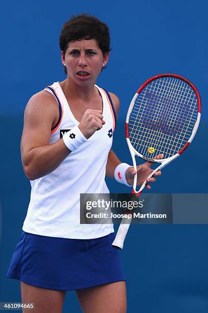 Carla Suarez Navarro of Spain celebrates winning the match against Ekaterina Makarova of Russia during day three of the 2014 Sydney International at...