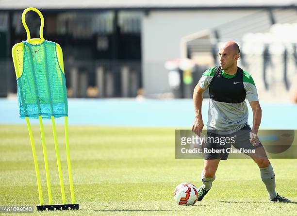 Mark Bresciano of Australia controls the ball during an Australian Socceroos training session at Lakeside Stadium on January 7, 2015 in Melbourne,...
