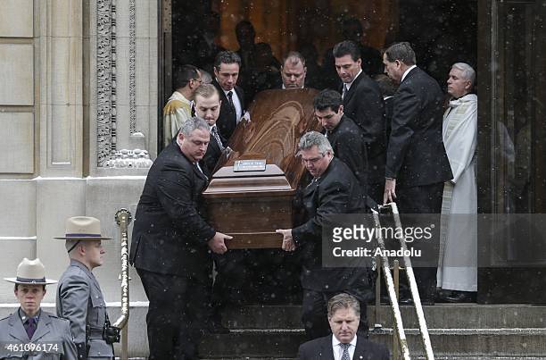 People carry the coffin of the former New York Governor Mario Cuomo, who died in New Years Day at the age of 82 during the funeral service in New...