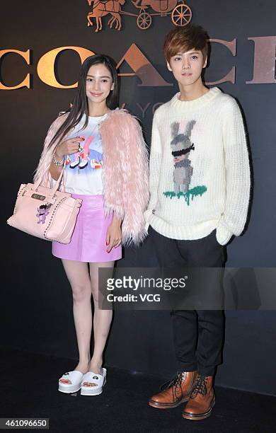 Actress Angelababy and EXO's Lu Han attend the opening ceremony for the Coach store at Shin Kong Place on January 6, 2015 in Beijing, China.