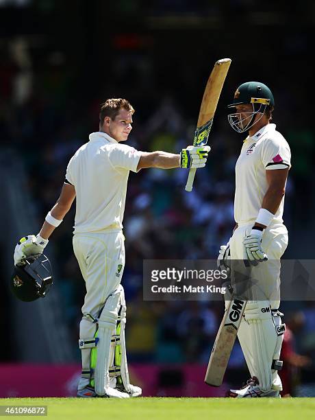 Steve Smith of Australia celebrates and acknowledges the crowd after scoring a century next to Shane Watson during day two of the Fourth Test match...