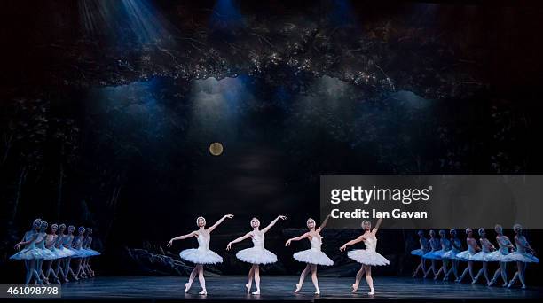 Dancers perform on stage during a dress rehearsal for The English National Ballet's "Swan Lake" at the London Coliseum on January 6, 2015 in London,...