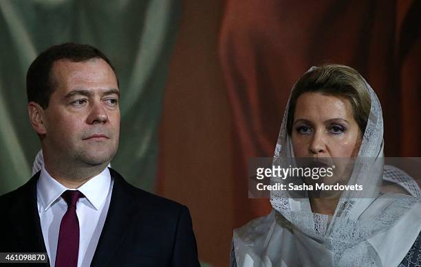 Russian Prime Minister Dmitry Medvedev and his spouse Svetlana Medvedeva attend a Christmas Mass in the Christ The Saviour Cathedral early January 7,...