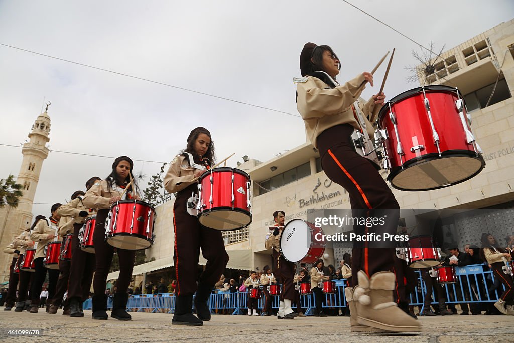 Palestinian Scouts perform in Manger Square in the West Bank...