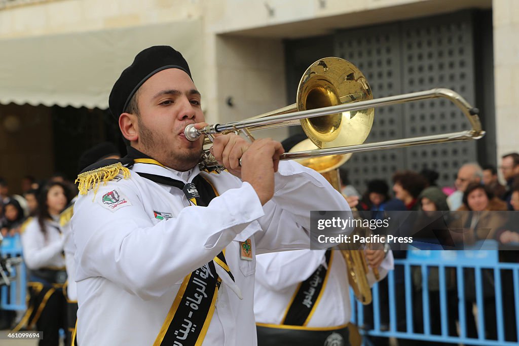 Palestinian Scouts perform in Manger Square in the West Bank...