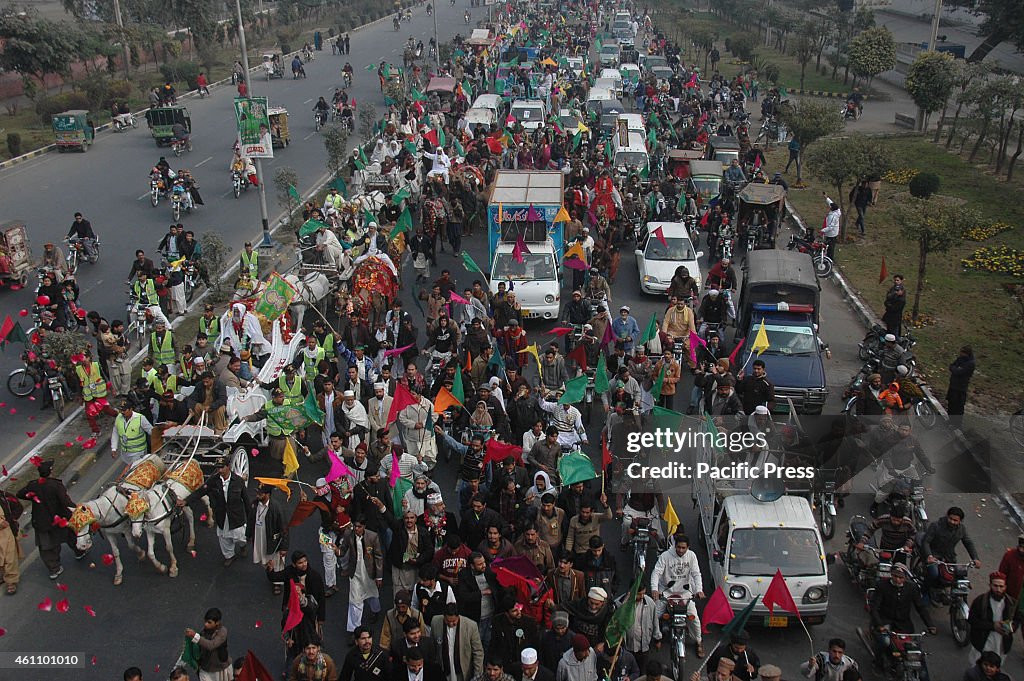 Pakistani Muslims participate in a rally celebrating the...