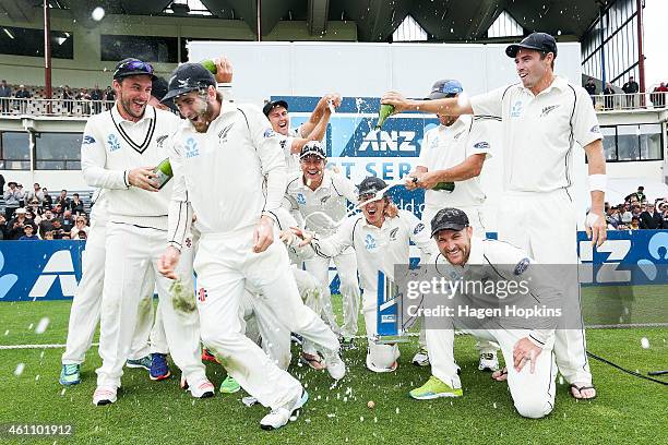 Kane Williamson escapes a dousing of champagne as New Zealand celebrate their ANZ Test Series win during day five of the Second Test match between...