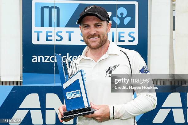 Captain Brendon McCullum poses with the ANZ Test Series trophy during day five of the Second Test match between New Zealand and Sri Lanka at Basin...