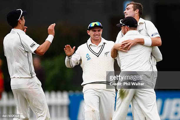 Tim Southee of New Zealand is hugged by Brendon McCullum as he celebrates his wicket of Nuwan Pradeep of Sri Lanka to win the match and the series...