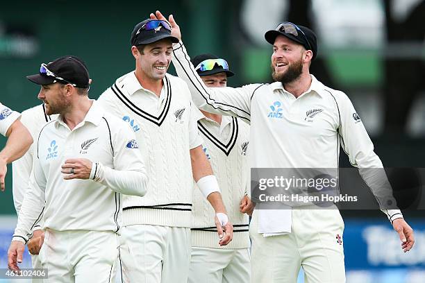 Mark Craig of New Zealand celebrates the series win with teammate Tim Southee during day five of the Second Test match between New Zealand and Sri...